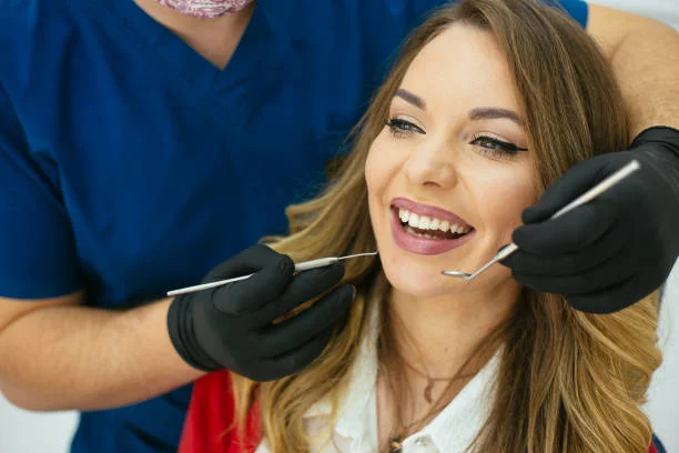 Woman smiling during dental check-up at 97smiles